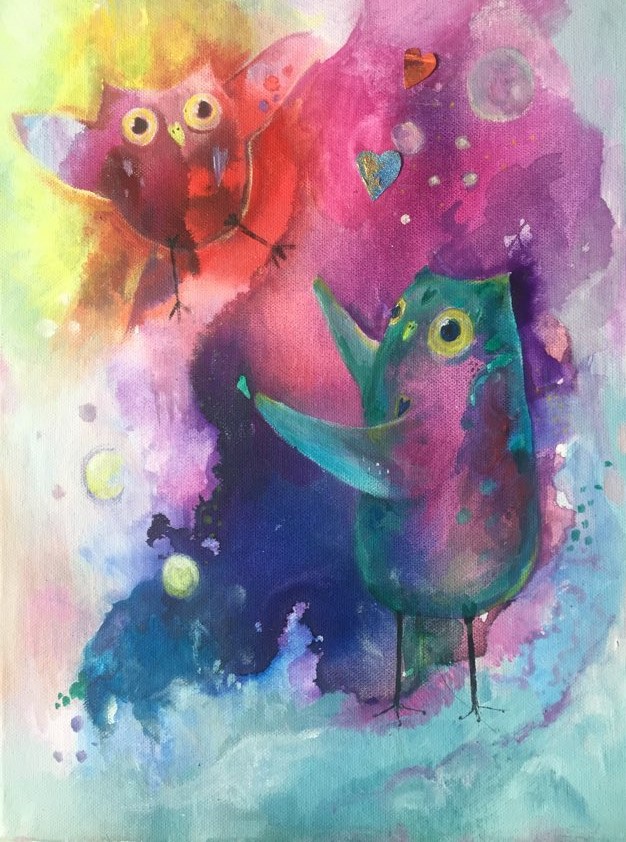 This image shows the soulful owl painting - The art of Letting Go. Mother owl is painted in teals and magenta. Her wings are open as she lets her baby owl go.The owlet is floating backwards into an abstract background of reds and yellows.