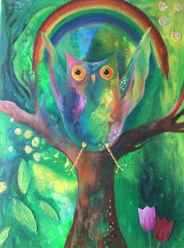 This image shows the colourful owl painting - The Spirit of Inspiration. A rainbow owl swings on a rainbow through a wild forest. Behind her is a tree with limbs outstretched. Leaves and seeds fall and 2 tulips look up to her as she flies through the air.