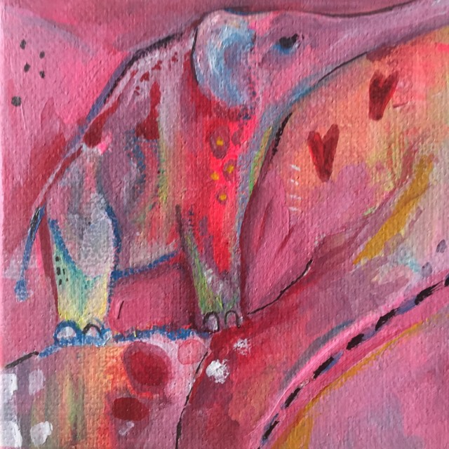 This Elephant painting called Gentle Power shows an abstract elephant spirit animal. She is painted in tones of pink and red with hints of yellow and two hearts float by her.