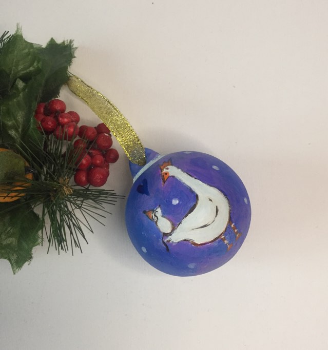 Unique keepsake Christmas bauble painted purple with gold ribbon. Hand painted with white goose and a white mouse standing together as friends under a dark blue heart.