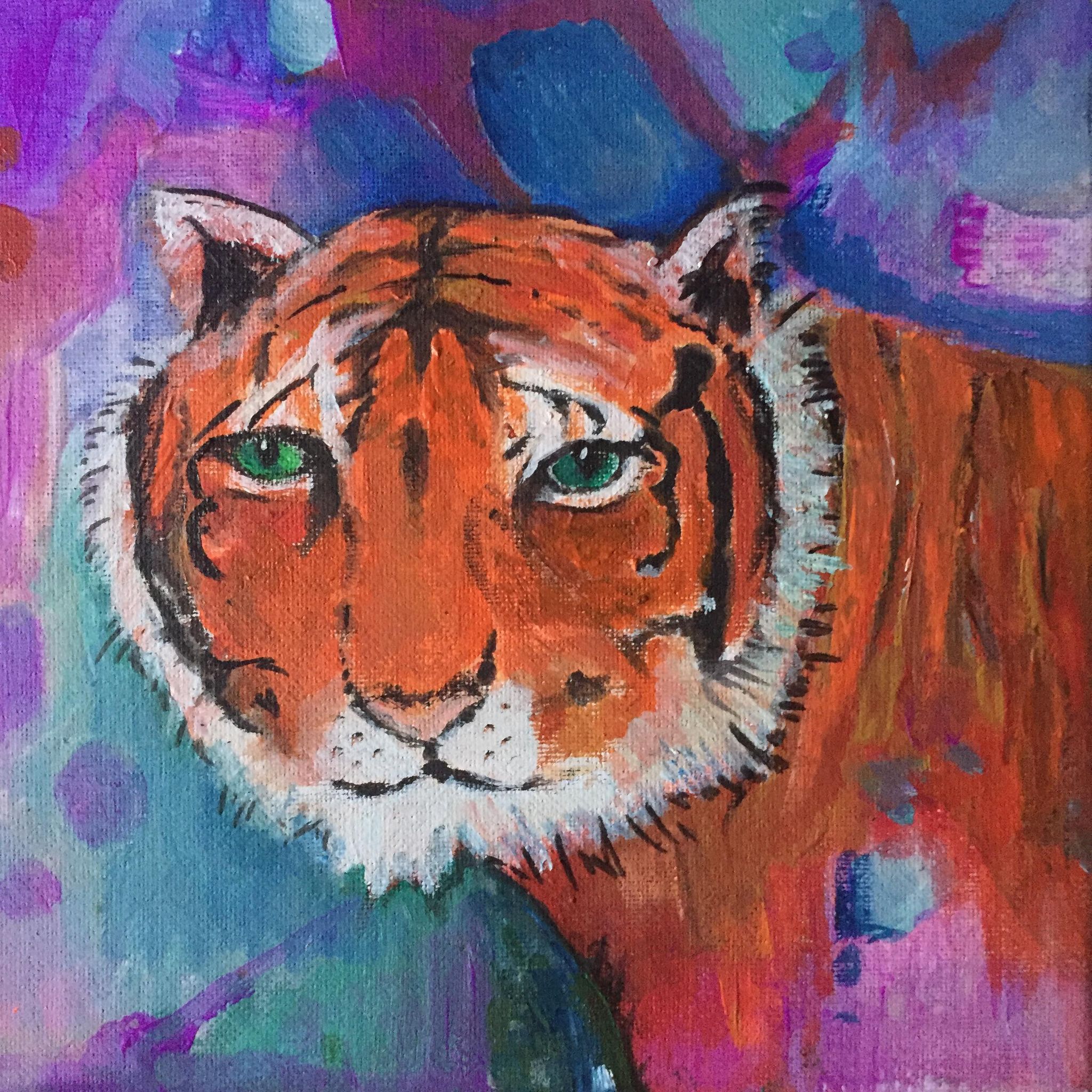 Tiger Art print. Tiger face painted as if emerging from an abstract background of purples and blues. Part of his body can be seen from the right of the painting.