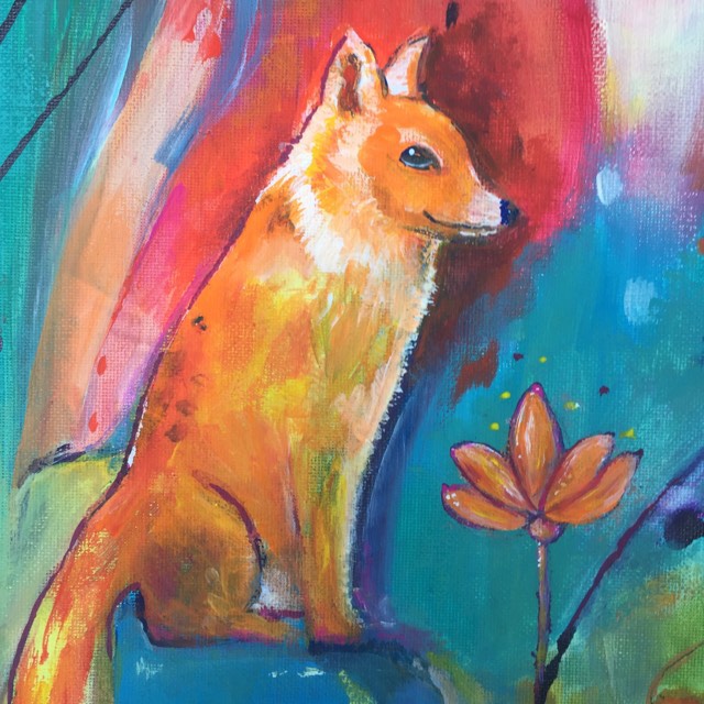 This whimsical fox print shows a close up of fox sitting beside a lotus flower of similar orange hues. She has a quietly cunning smile. She is painted against an abstract and colourful background of aqua, red, pink and purple tones.