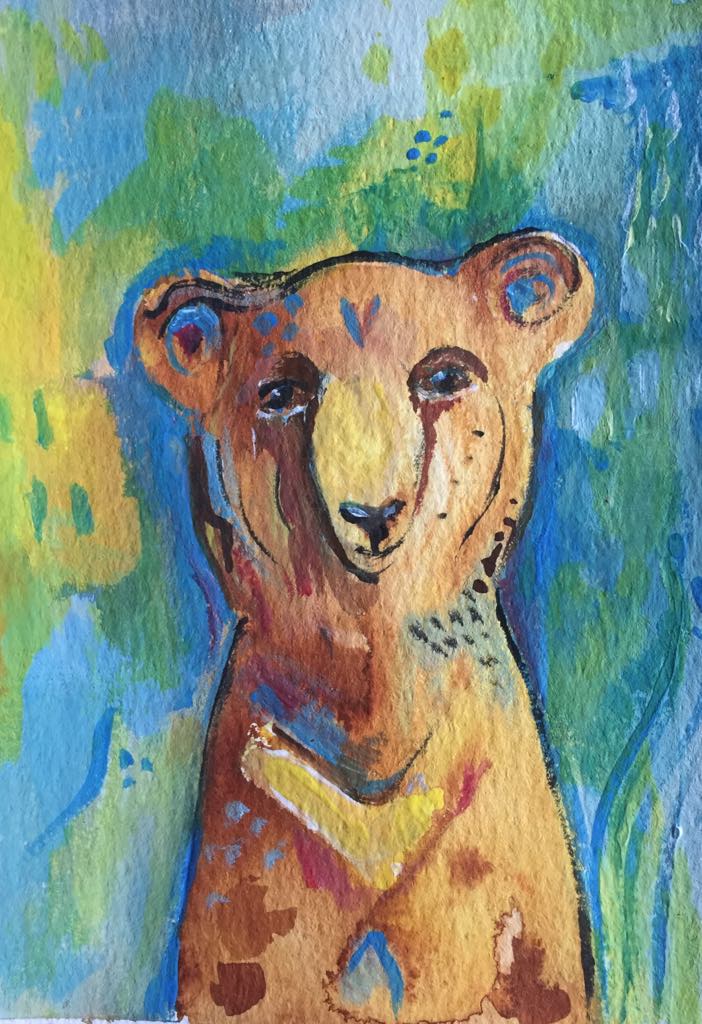 Magical bear art - this painting shows the sun bear radiating her inner light. She is painted in soulful browns and yellows and she stands against a background of abstract blues, yellows and greens.