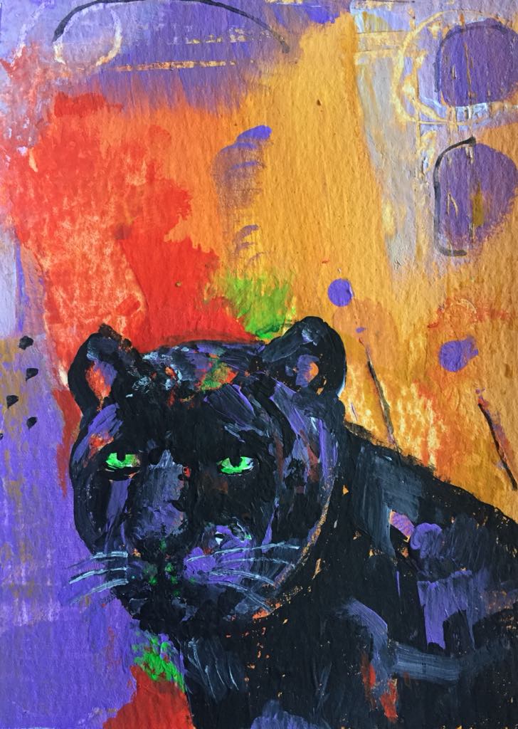 This magical panther art shows panther staring out of the painting with strength, focus and determination. She is sleek black with highlights of purple and vermillion. Her green eyes glow. She stands against an abstract background of yellow ochre, orange and purple.