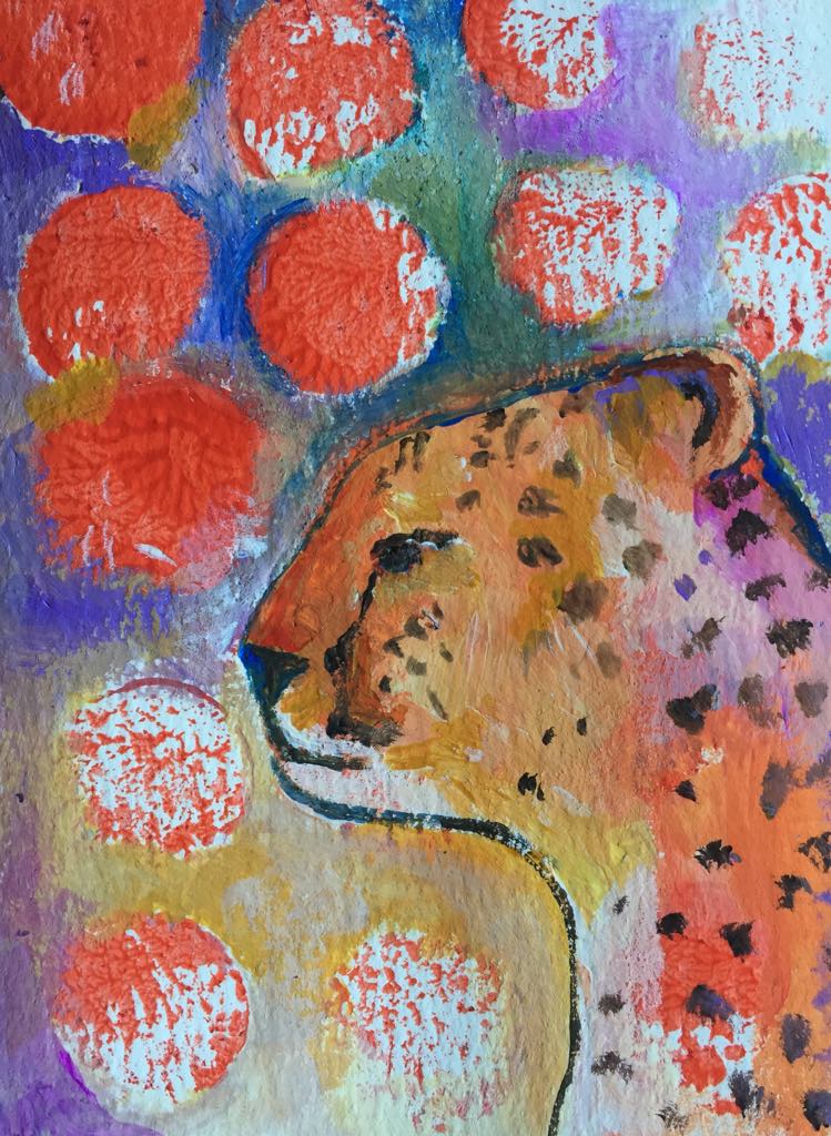 Magical cheetah art - this painting shows cheetah's face from a side profile looking focused and determined. Her profile is painted on an abstract and spotty background of red dots and blues, greens and yellows.