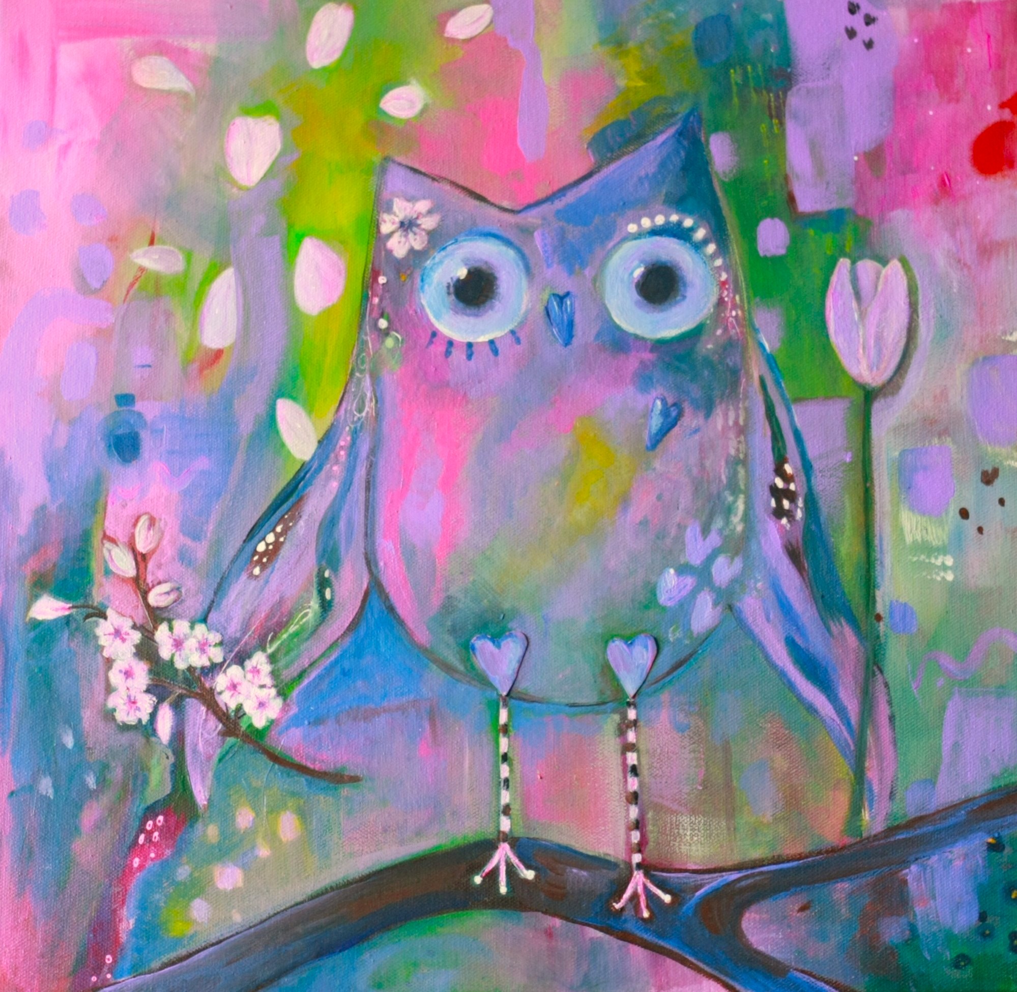 Beautiful owl art painted in tones of pink, purple and green. She holds a sprig of cherry blossom in her left wing and a pink tulip in the other. Cherry blossom petals float down beside her as she stands on a branch ready to fly.
