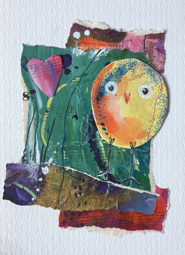 Magical and Whimsical Owling Art made from collage papers. The yellow-orange Owling stands on a background of greens, pinks, gold and purple. A pink collage heart floats above her.