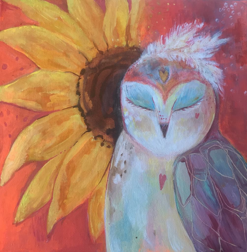 This magical owl painting shows a barn owl inspired whimsical owl with eyes closed as if dreaming. Behind her there is a large sunflower. On her head there are white feathers. The background is deep vermillion and oeange tones.